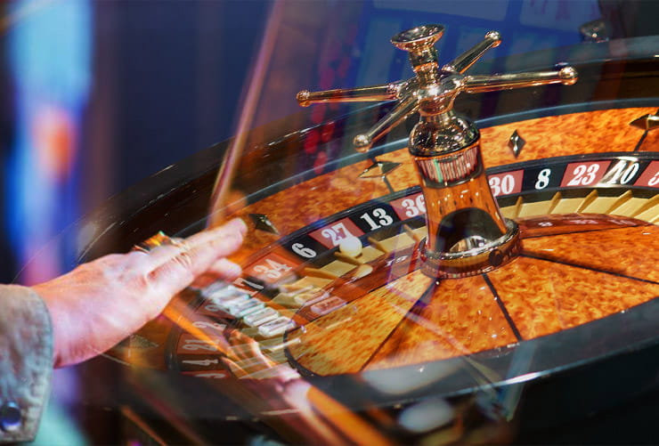 An Atlantis casino patron playing roulette.