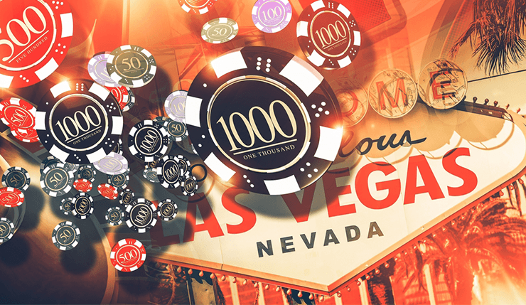 Nevada casino chips fall in front of the Las Vegas city sign. 