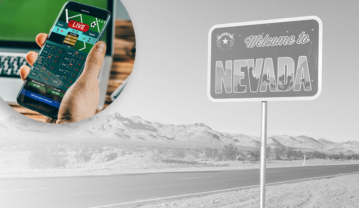 Someone using a smartphone to place a sports bet in Nevada. 