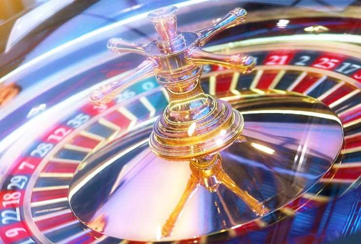 A roulette wheel spins.