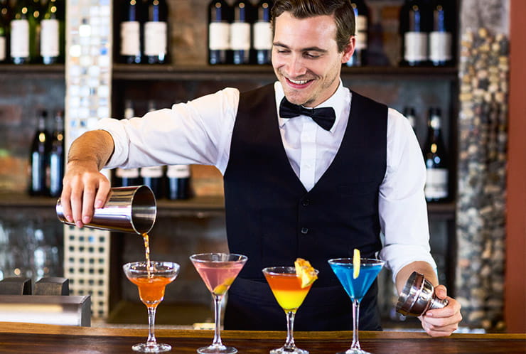 A bartender making cocktails.