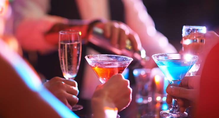 A bartender making cocktails.